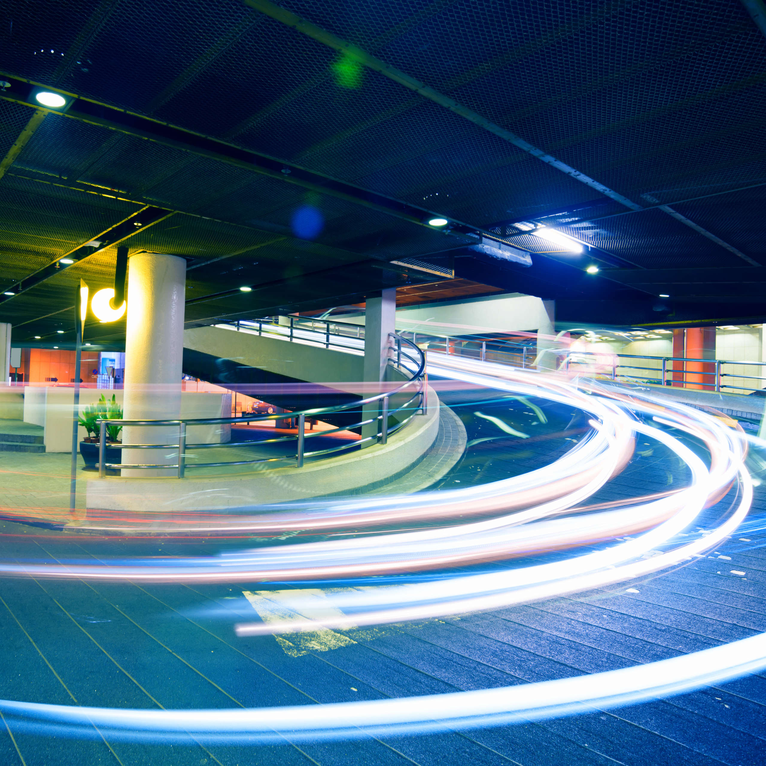 Car light trails in the parking lot